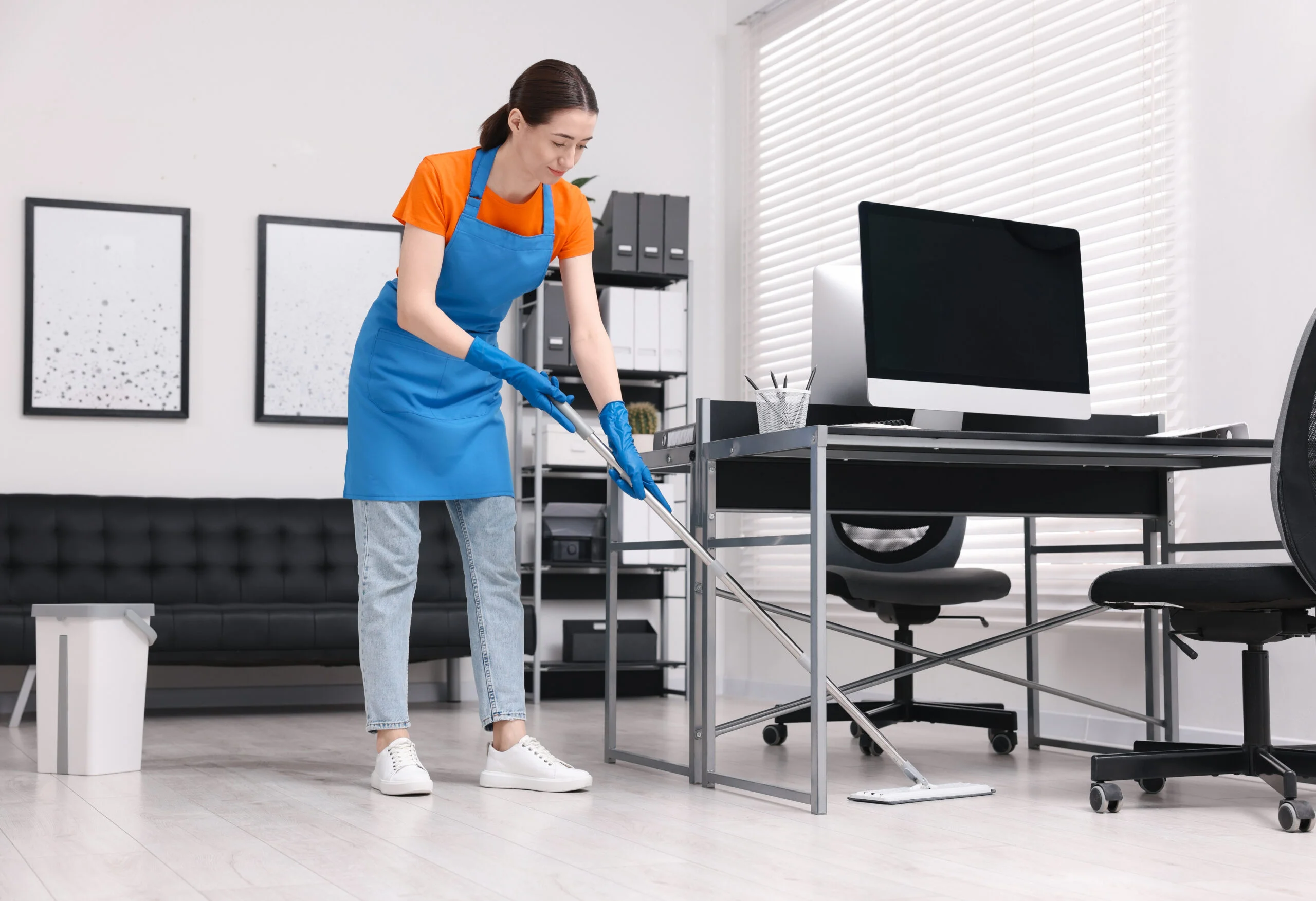 Commercial Day Porter ensuring spotless lobby floors with professional mopping services during business hours