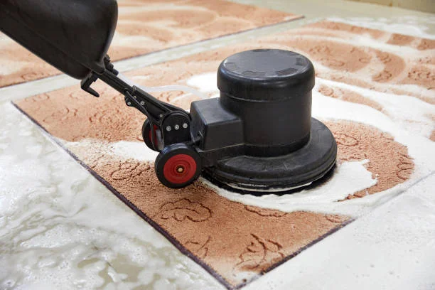 Professional technician using a commercial carpet cleaning machine for deep maintenance in a Bay Area office building.